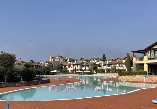 Apartment in Manerba del Garda - La Rocca Di Manerba relaxing pool  By Bookinggarda
