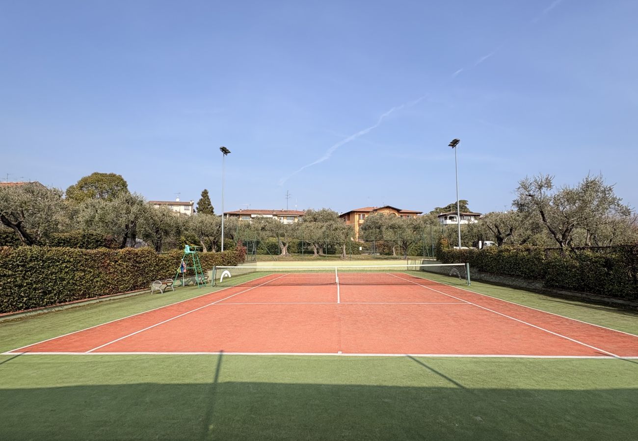 Apartment in Manerba del Garda - La Rocca Di Manerba relaxing pool  By Bookinggarda