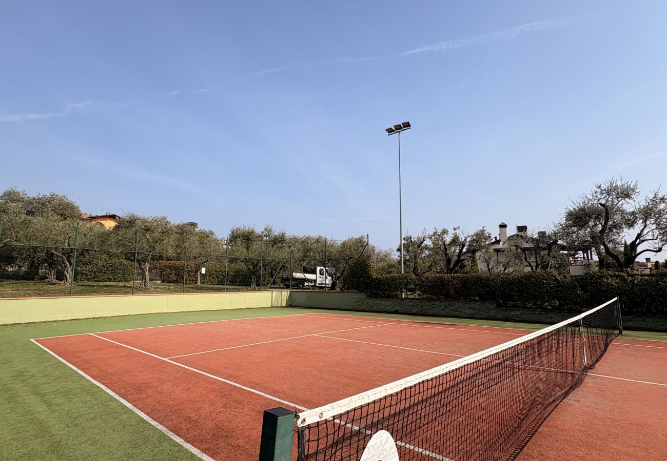 Apartment in Manerba del Garda - La Rocca Di Manerba relaxing pool  By Bookinggarda